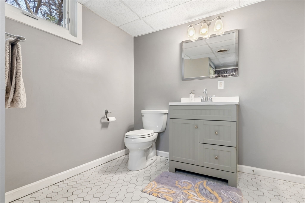 4 Valley Road Danvers, MA 01923 - Photo 28 of 42 a bathroom with a toilet sink and mirror