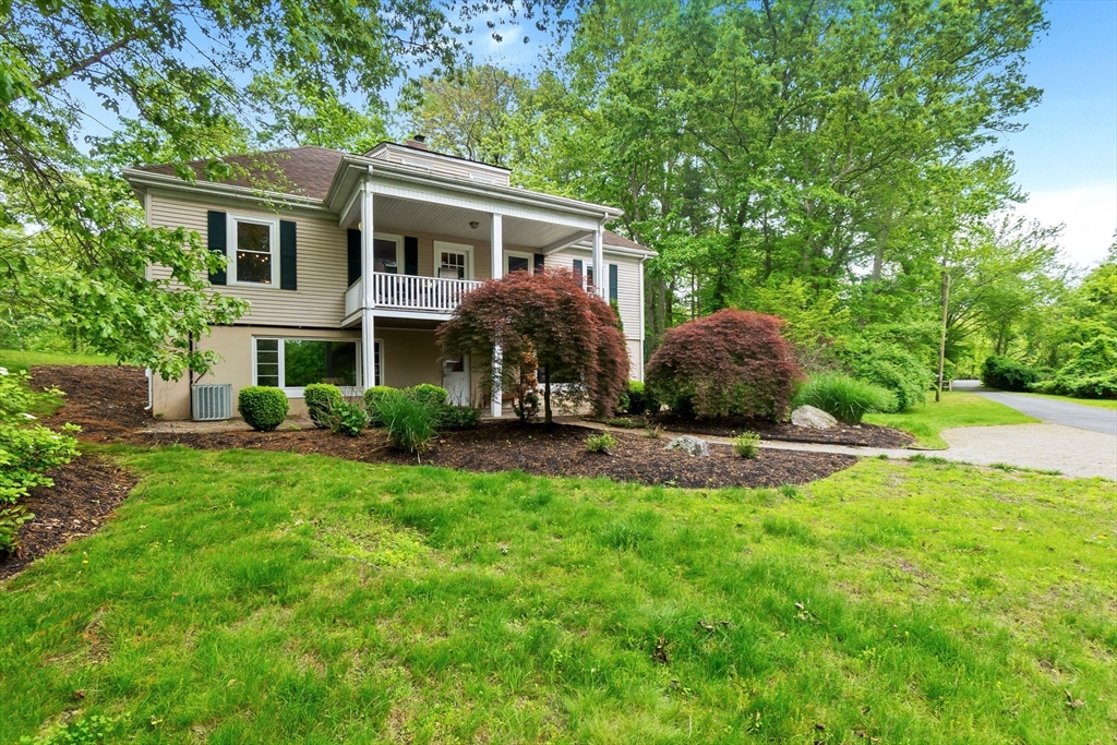 4 Valley Road Danvers, MA 01923 - Photo 31 of 42 a view of a house with a yard and sitting area
