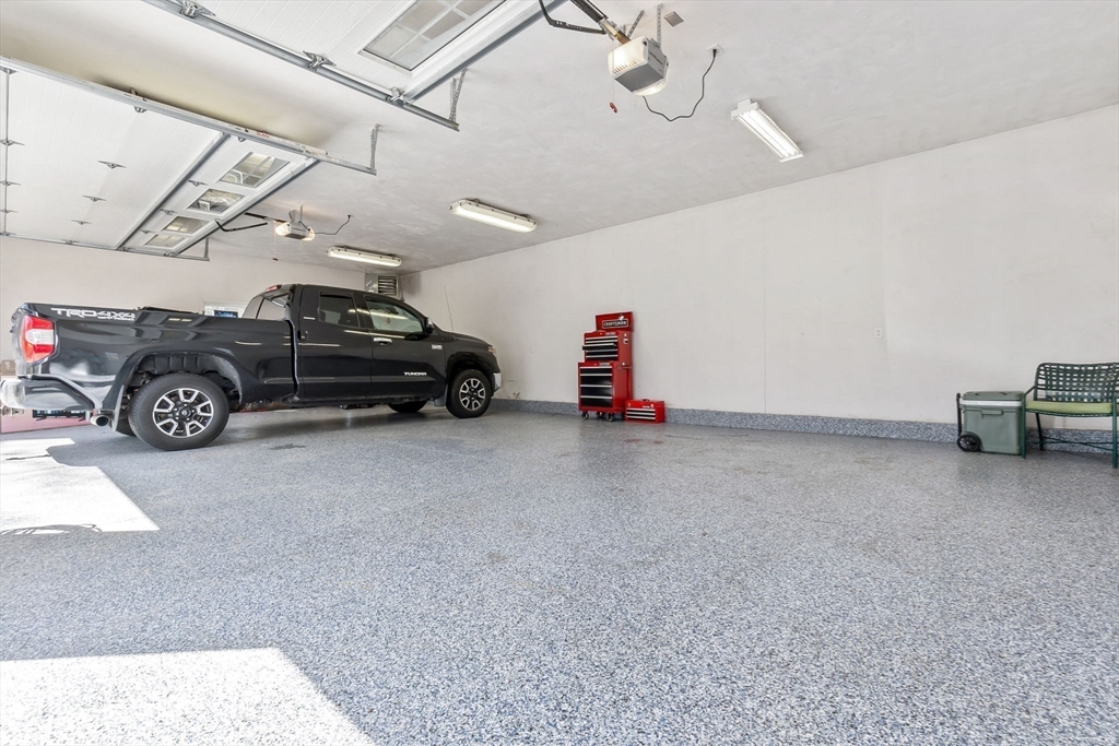 4 Valley Road Danvers, MA 01923 - Photo 35 of 42 a car parked in a garage