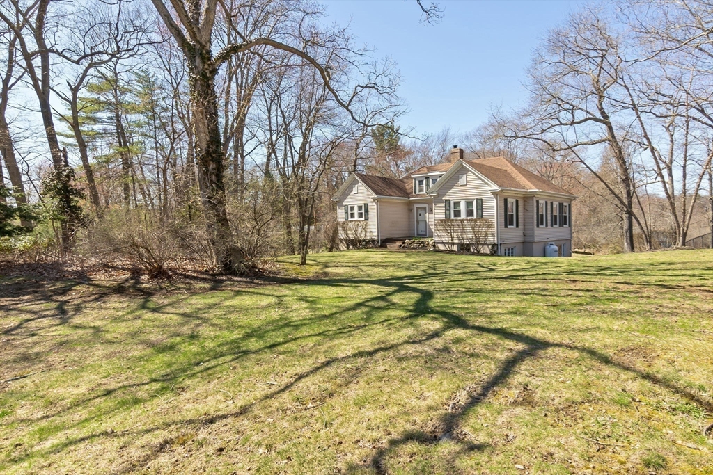 4 Valley Road Danvers, MA 01923 - Photo 37 of 42 a front view of residential houses with yard and trees