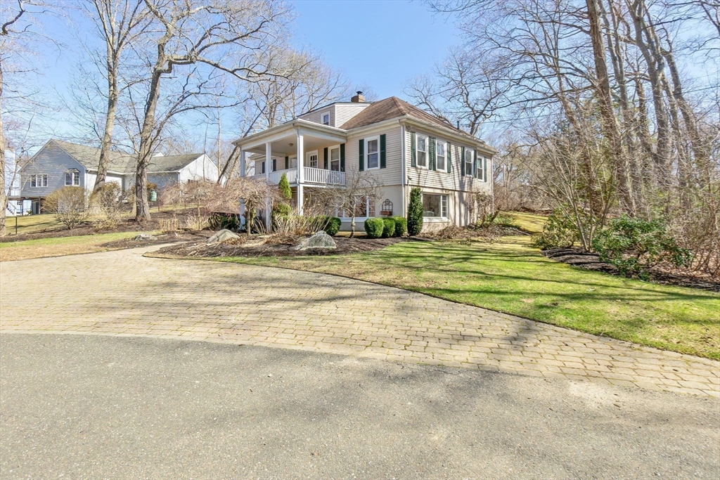 4 Valley Road Danvers, MA 01923 - Photo 38 of 42 a front view of a house with a yard