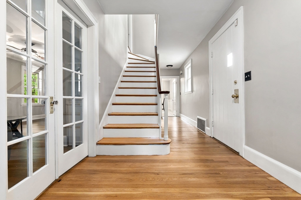 4 Valley Road Danvers, MA 01923 - Photo 4 of 42 a view of an entryway with wooden floor and stairs