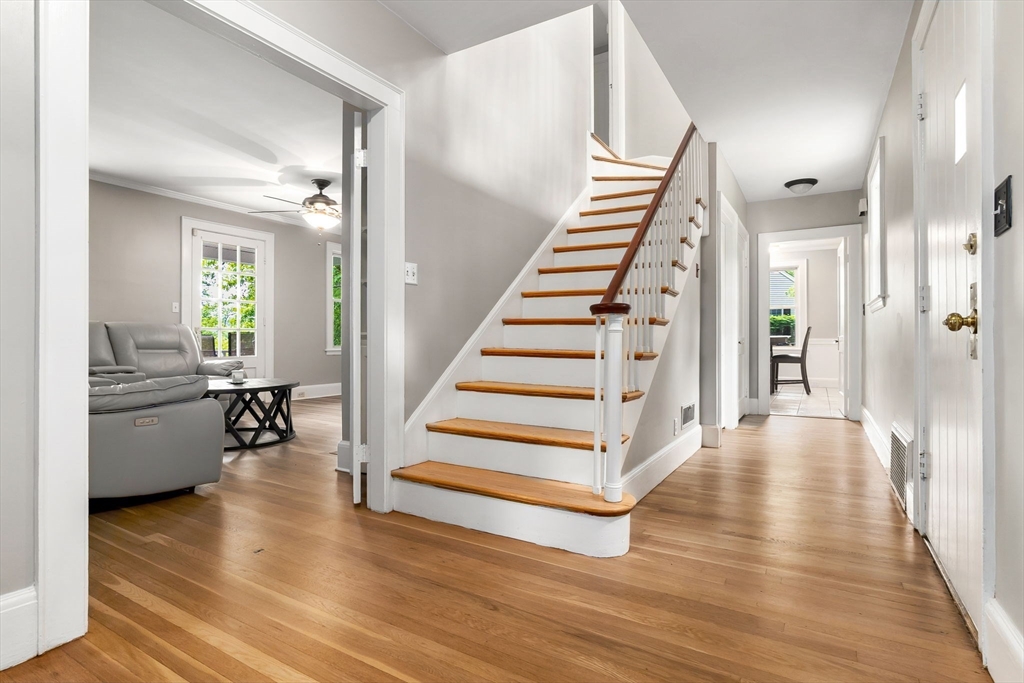 4 Valley Road Danvers, MA 01923 - Photo 5 of 42 a view of a hallway view with wooden floor and staircase