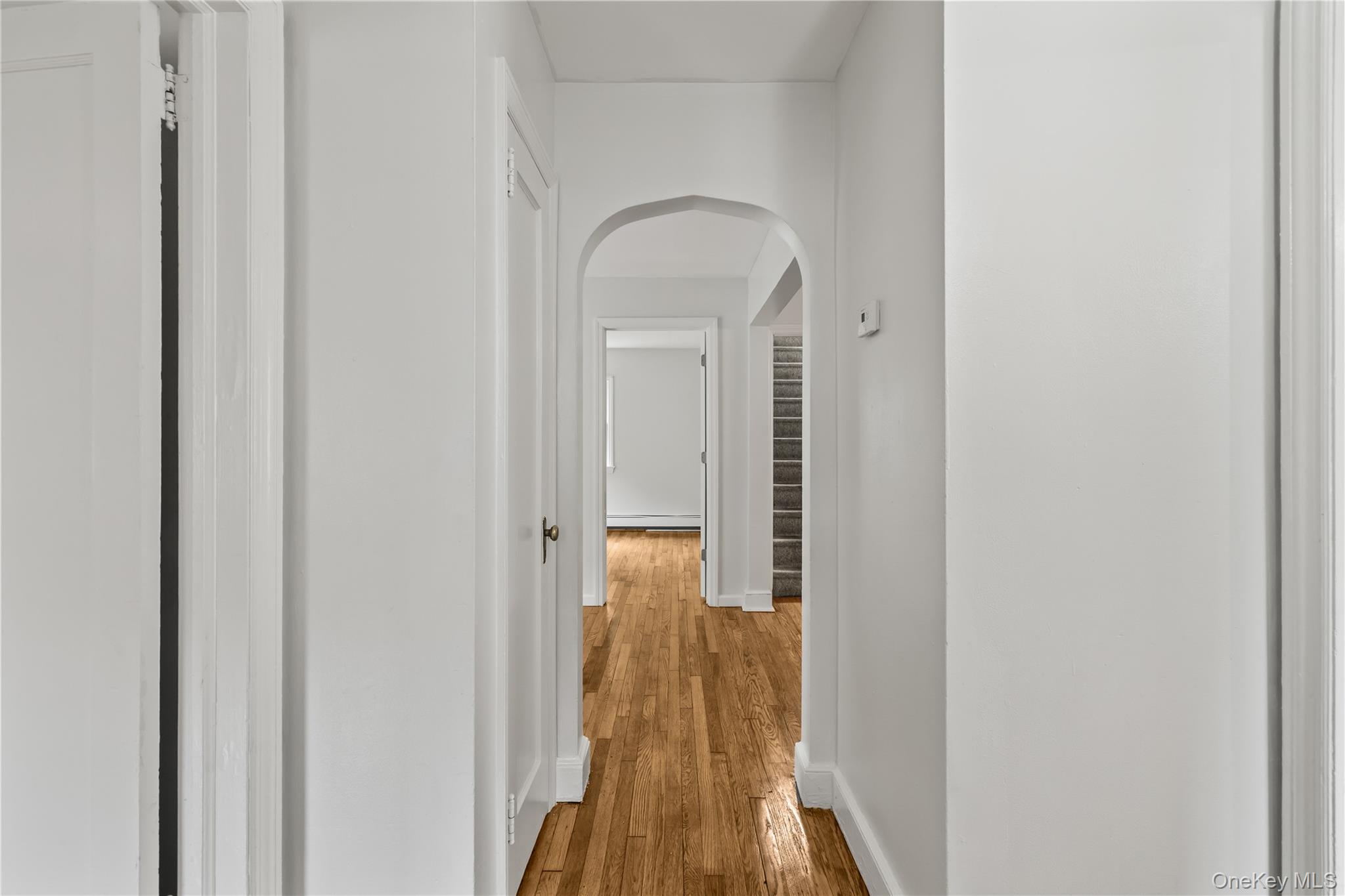 281-283 Old Haverstraw Road Congers, NY 10920 - Photo 18 of 41 a view of a hallway with wooden floor and a bathroom