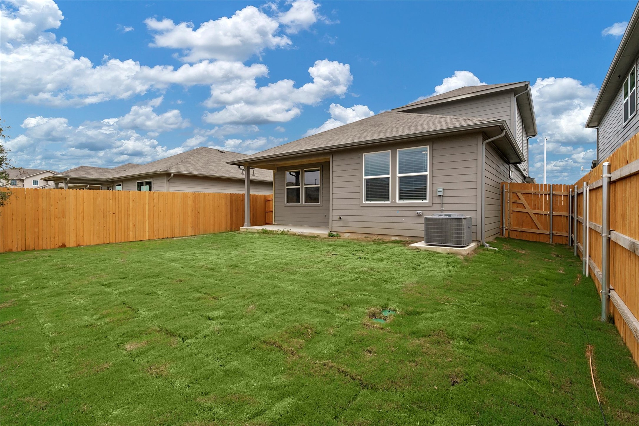 2909 Tweedy Trail Pflugerville, TX 78660 - Photo 27 of 27 A neatly fenced backyard offers privacy and ample green space for outdoor activities.