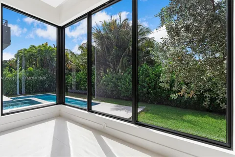 a view of a glass door and a yard