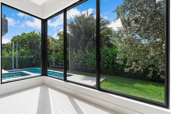 a view of a glass door and a yard