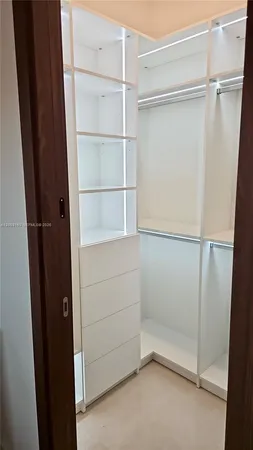 a view of an empty walk in closet