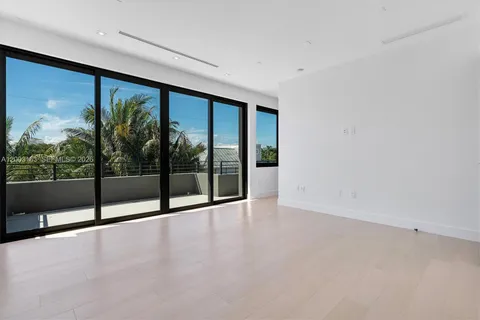 wooden floor in an empty room with large windows