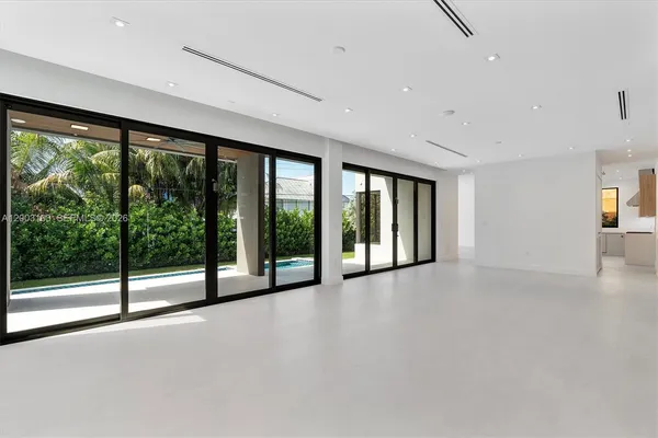 a view of an ocean with a floor to ceiling window