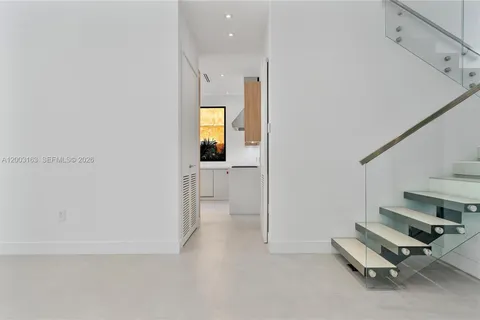 a view of a hallway with a room