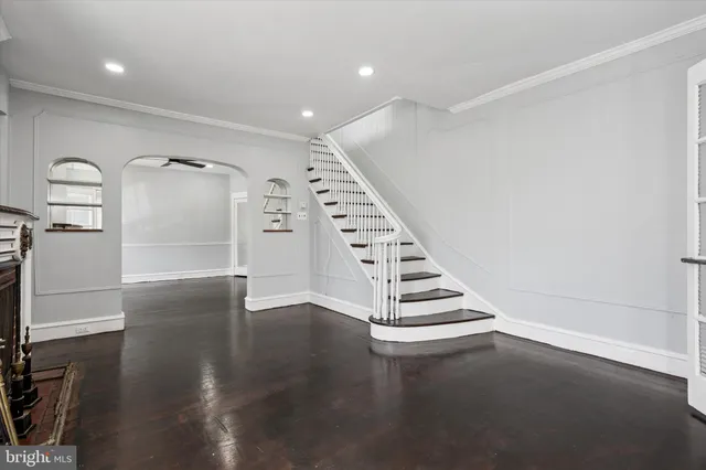a view of an entryway with wooden floor