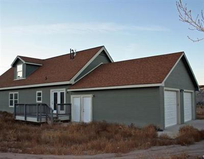 58 Alpine Ranch Road Gypsum, CO 81637 - Photo 15 of 20 a front view of a house with garden