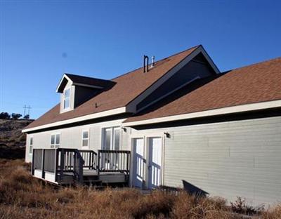 58 Alpine Ranch Road Gypsum, CO 81637 - Photo 3 of 20 a view of wooden house with a street