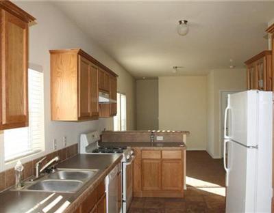 58 Alpine Ranch Road Gypsum, CO 81637 - Photo 8 of 20 a kitchen with a sink refrigerator and window