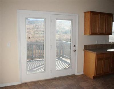 58 Alpine Ranch Road Gypsum, CO 81637 - Photo 10 of 20 a view of empty room with wooden floor and fan