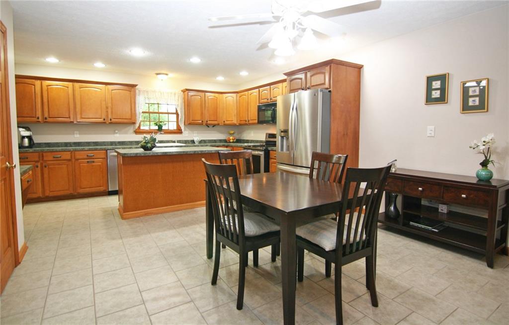 The spacious kitchen is a cook's delight! Stainless appliances include dishwasher, electric stove, microwave oven and refrigerator.  A planning desk and pantry are also provided.