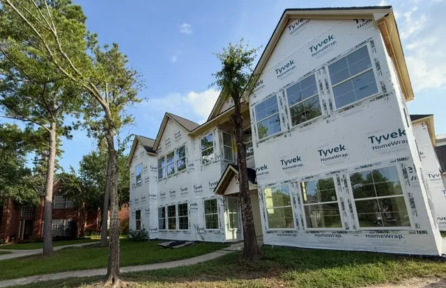 front view of a house with a garden