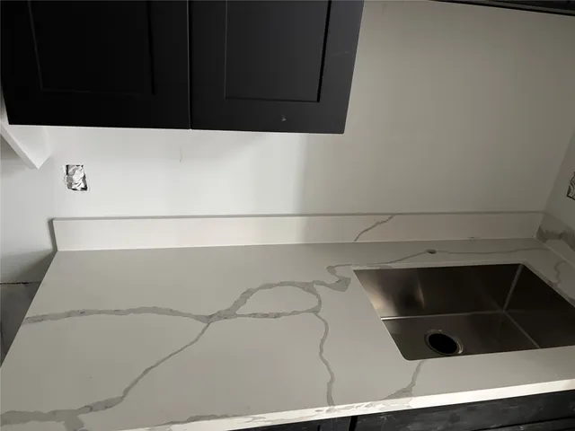 a large white bed in a white room