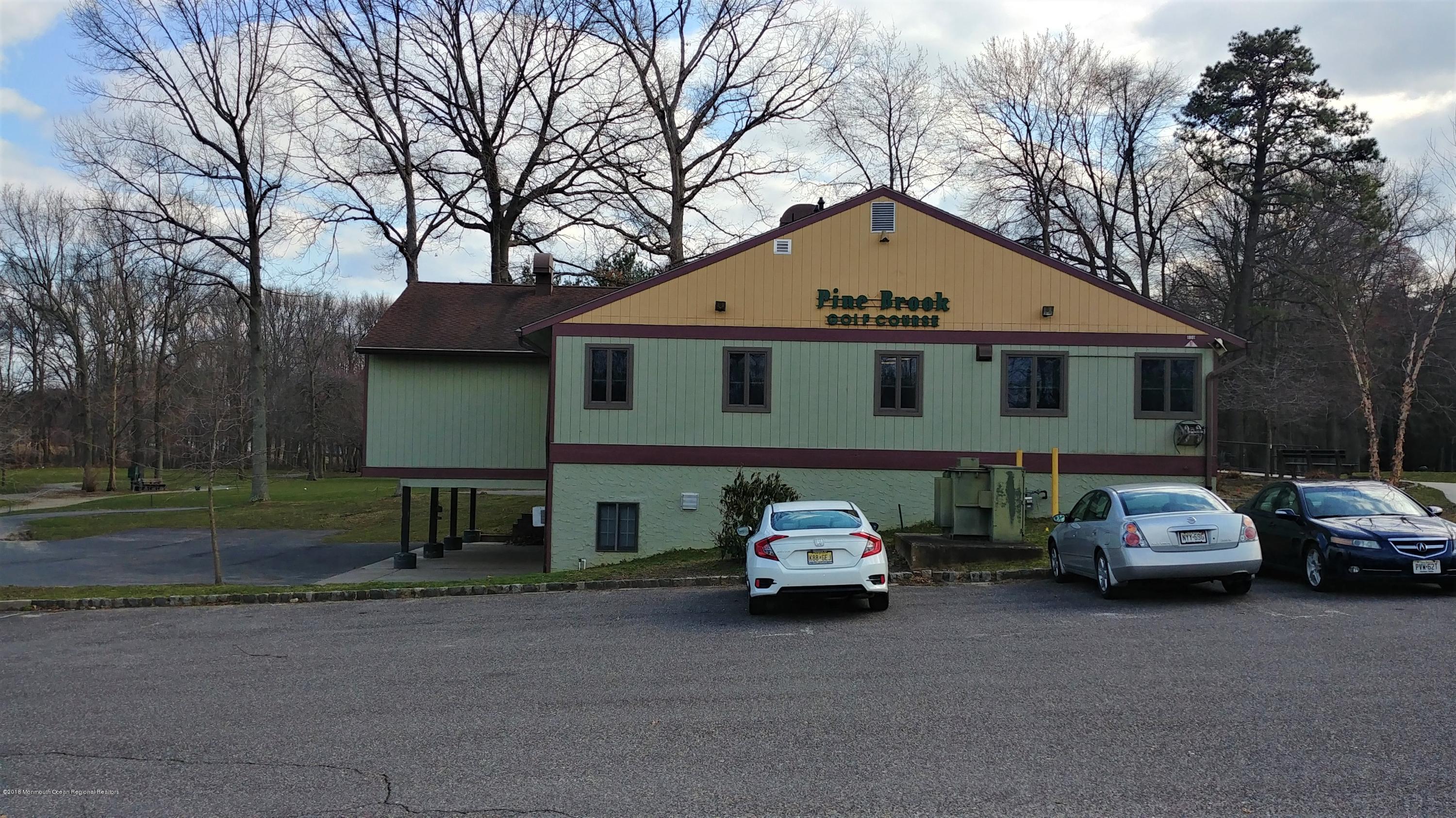 177 Amberly Drive, Unit K Manalapan, NJ 07726 - Photo 12 of 19 a car parked in front of a house