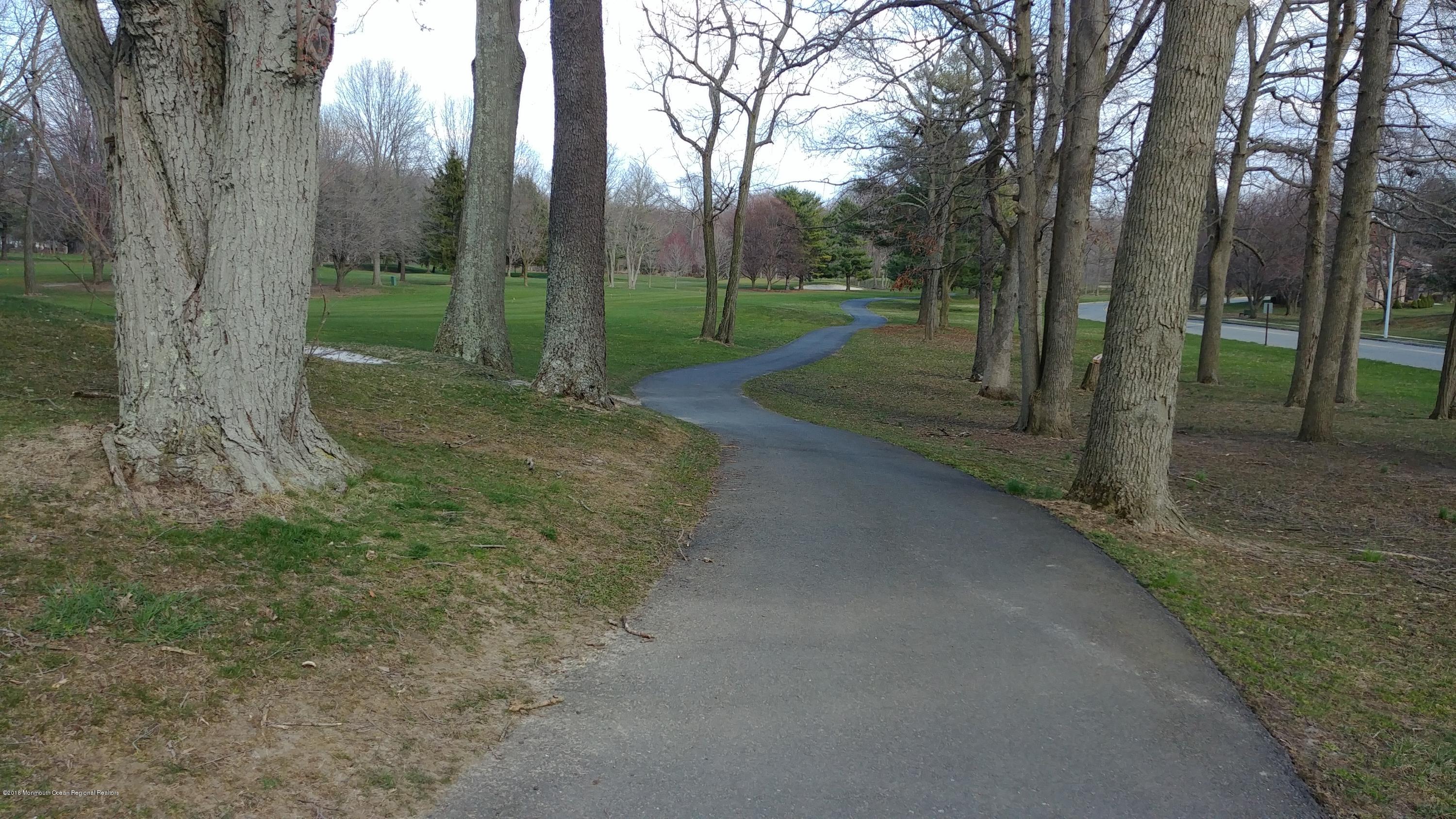 177 Amberly Drive, Unit K Manalapan, NJ 07726 - Photo 17 of 19 a view of a park