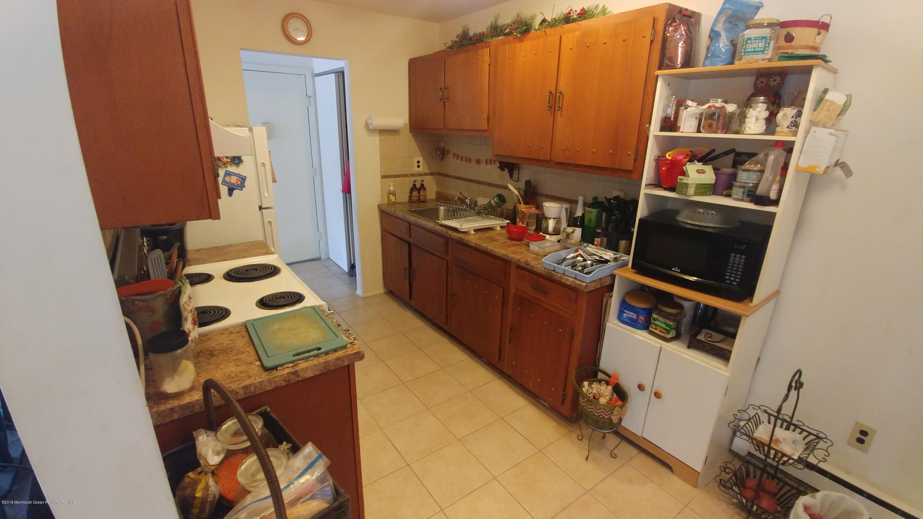 177 Amberly Drive, Unit K Manalapan, NJ 07726 - Photo 4 of 19 a room with storage and utility