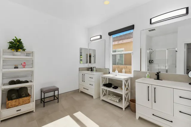 a utility room with cabinets dryer and washer