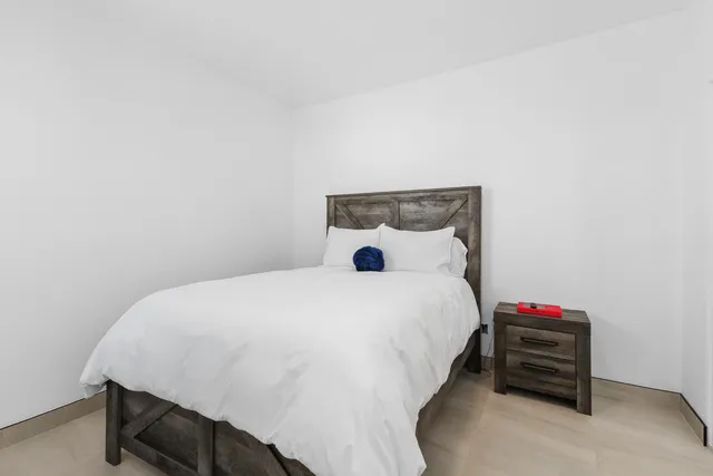 a bedroom with a bed and a closet