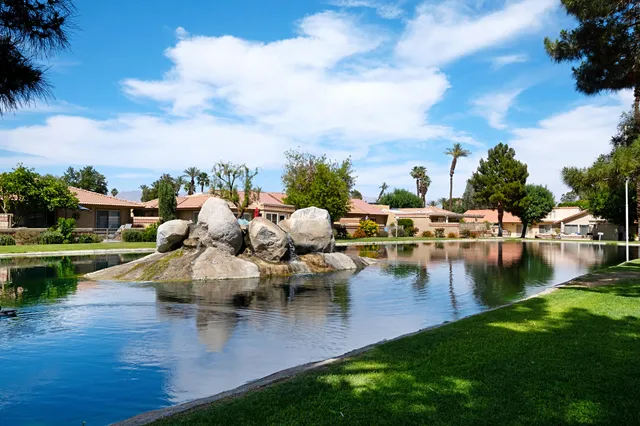 a view of a swimming pool with a patio