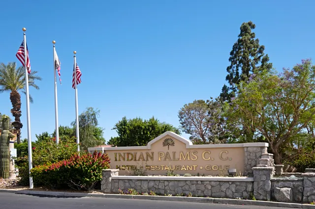 a view of a swimming pool with outdoor seating