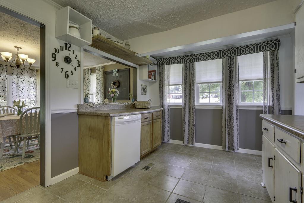 301 Whitson Road Bethpage, TN 37022 - Photo 12 of 29 a kitchen with a refrigerator and a stove