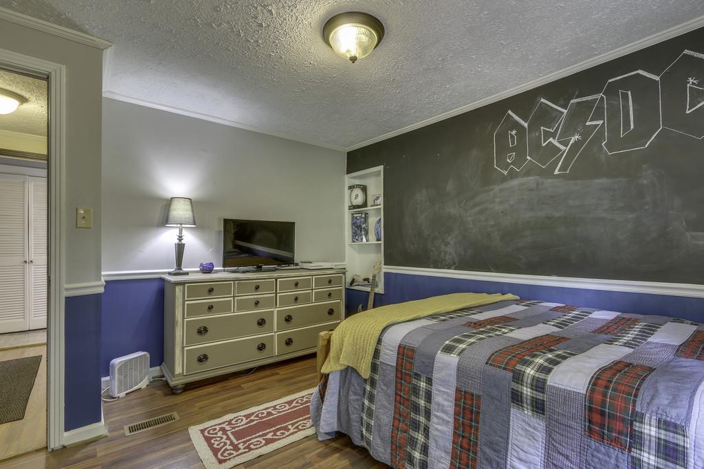 301 Whitson Road Bethpage, TN 37022 - Photo 23 of 29 a bedroom with a bed and a television