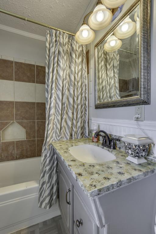 301 Whitson Road Bethpage, TN 37022 - Photo 25 of 29 a bathroom with a granite countertop sink and a mirror