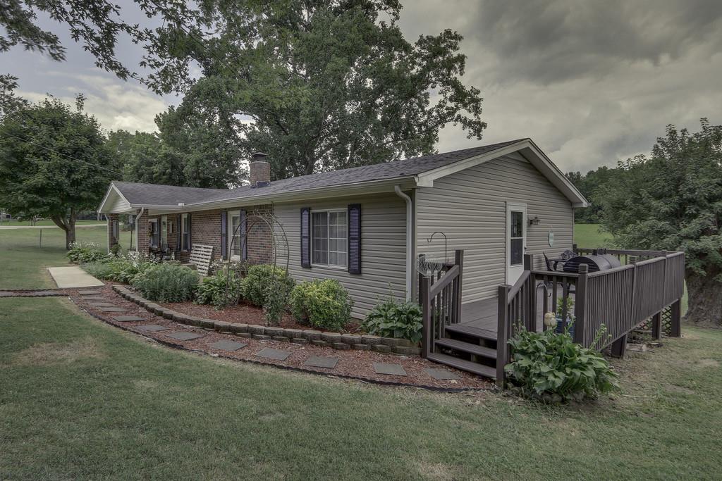301 Whitson Road Bethpage, TN 37022 - Photo 3 of 29 a view of a house with backyard and garden