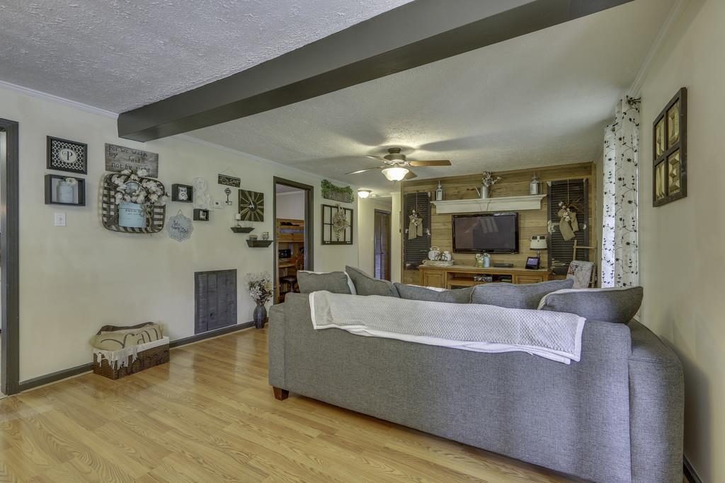 301 Whitson Road Bethpage, TN 37022 - Photo 5 of 29 a living room with furniture and a flat screen tv