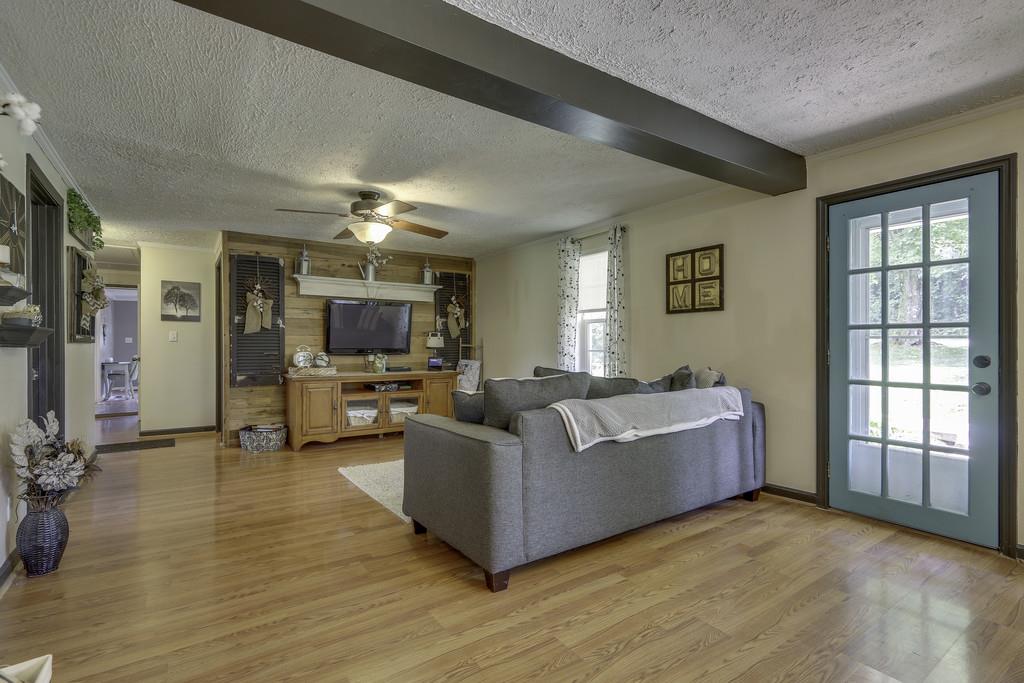 301 Whitson Road Bethpage, TN 37022 - Photo 6 of 29 a living room with furniture and a flat screen tv