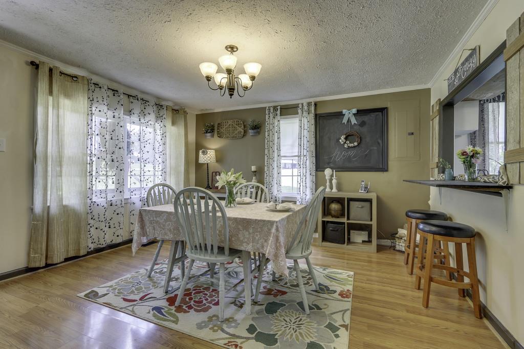 301 Whitson Road Bethpage, TN 37022 - Photo 8 of 29 a view of a dining room with furniture window and wooden floor