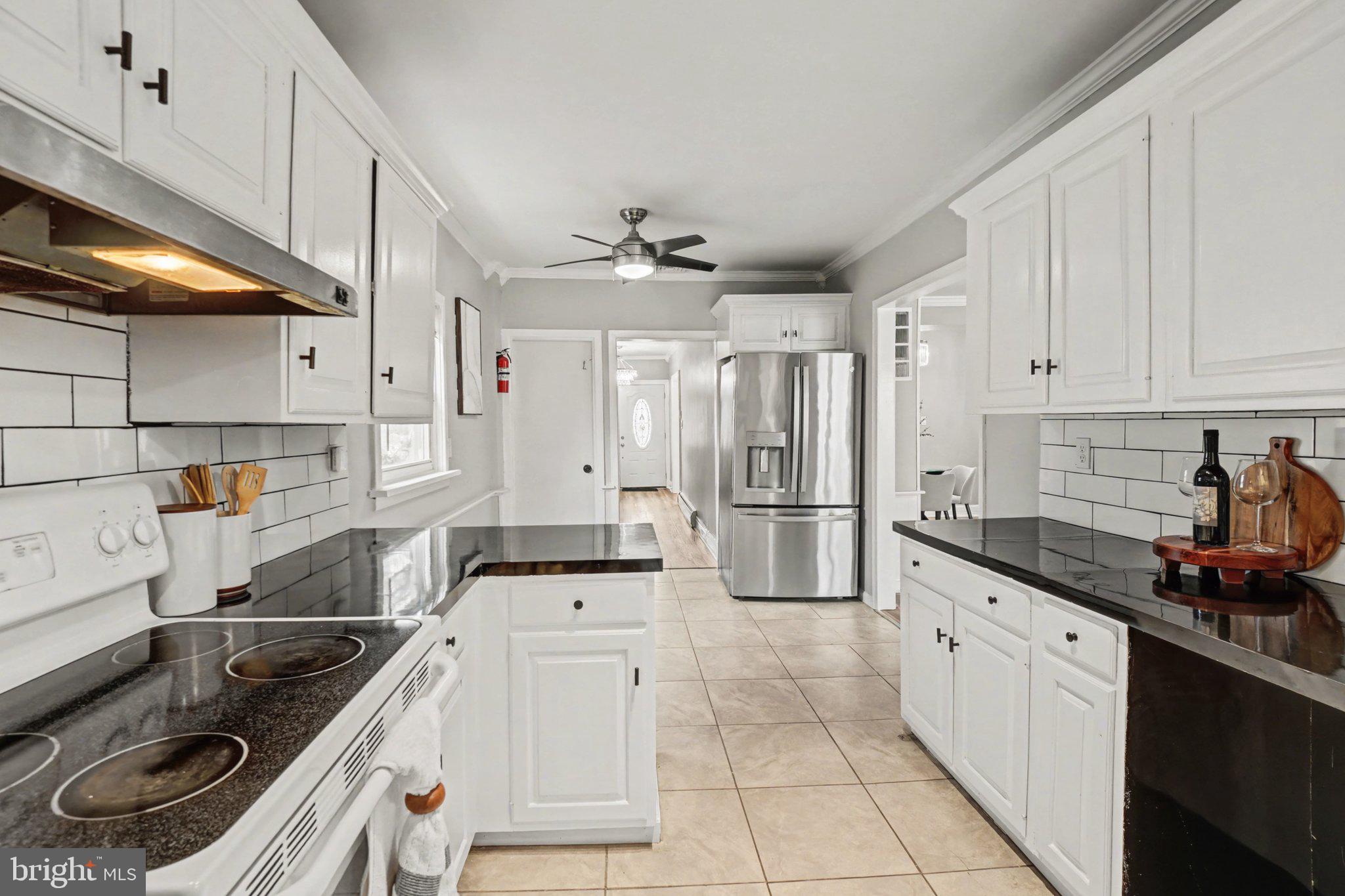 808 Locust Street Lebanon, PA 17042 - Photo 13 of 33 a kitchen with granite countertop a sink a stove and refrigerator