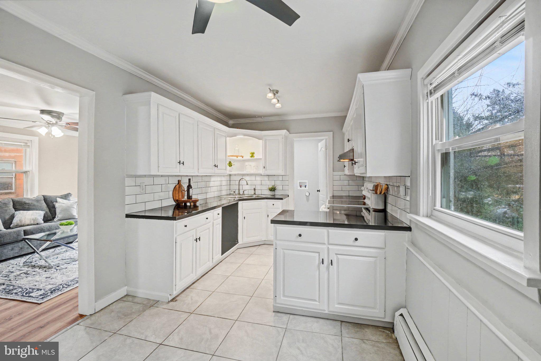 808 Locust Street Lebanon, PA 17042 - Photo 14 of 33 a kitchen with white cabinets and white appliances
