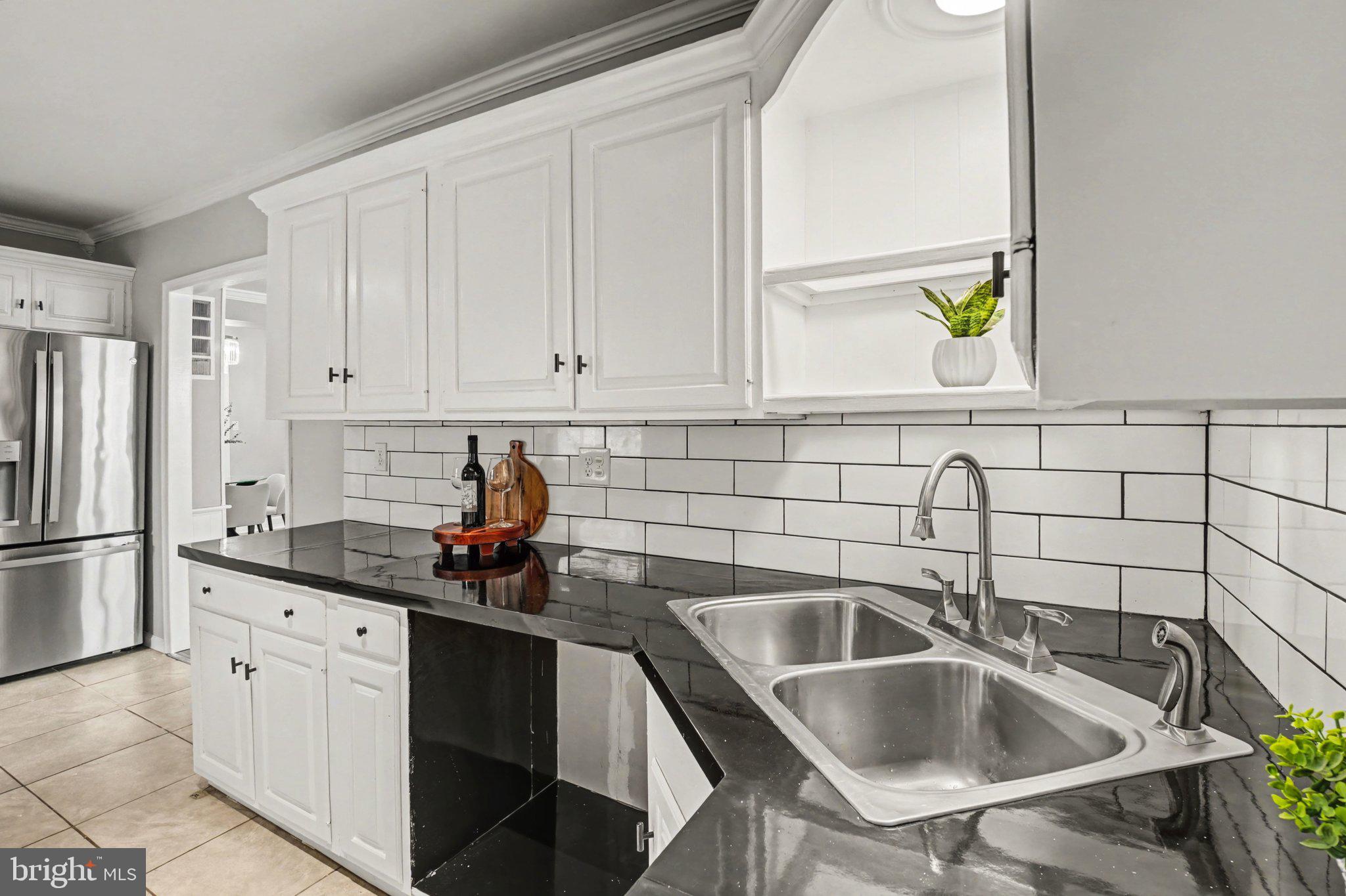 808 Locust Street Lebanon, PA 17042 - Photo 15 of 33 a kitchen with a sink cabinets and stainless steel appliances