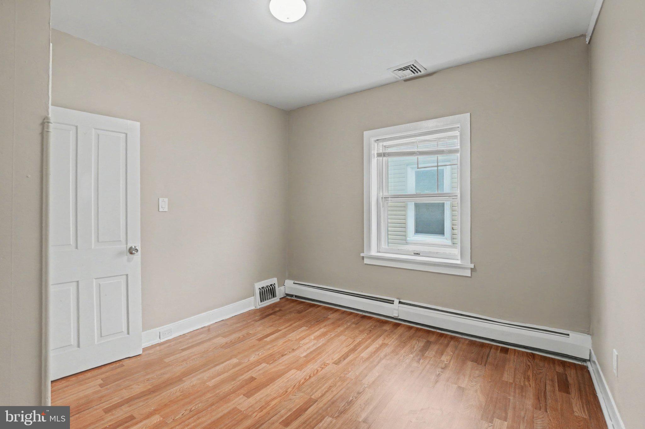 808 Locust Street Lebanon, PA 17042 - Photo 19 of 33 a view of empty room with wooden floor and fan
