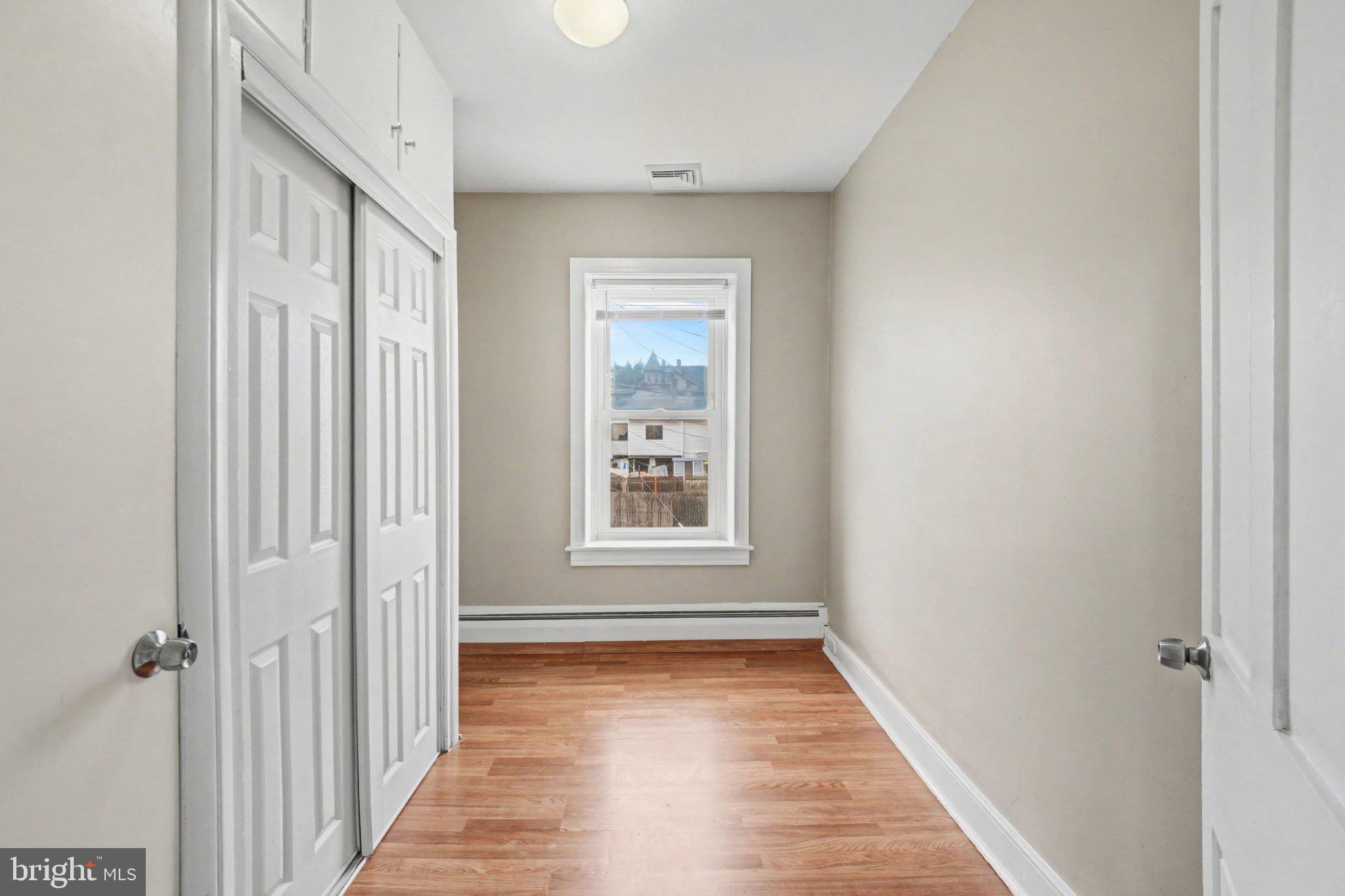 808 Locust Street Lebanon, PA 17042 - Photo 22 of 33 a view of a hallway with wooden floor and a window