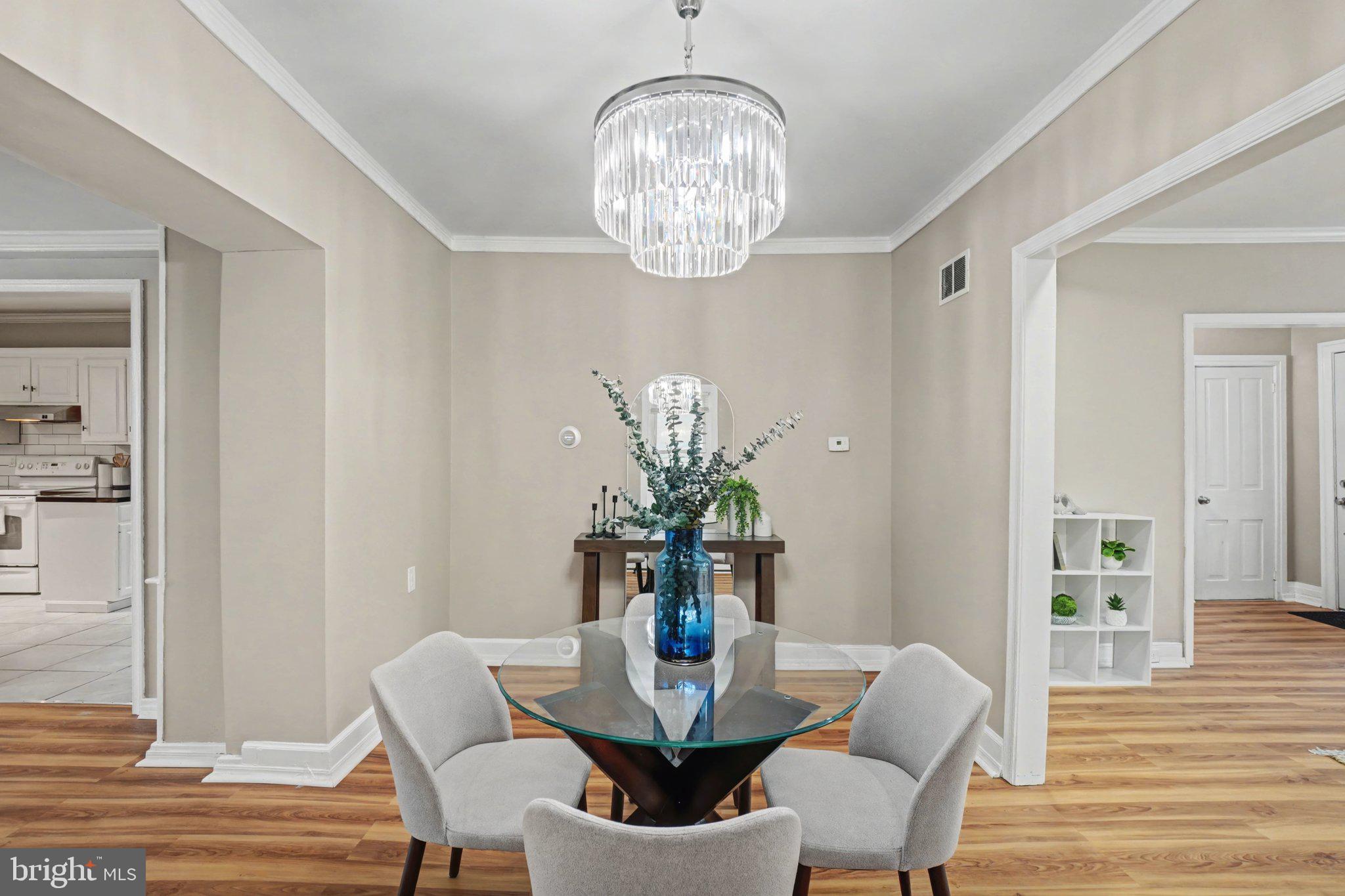 808 Locust Street Lebanon, PA 17042 - Photo 7 of 33 a view of a dining room with furniture wooden floor and a chandelier