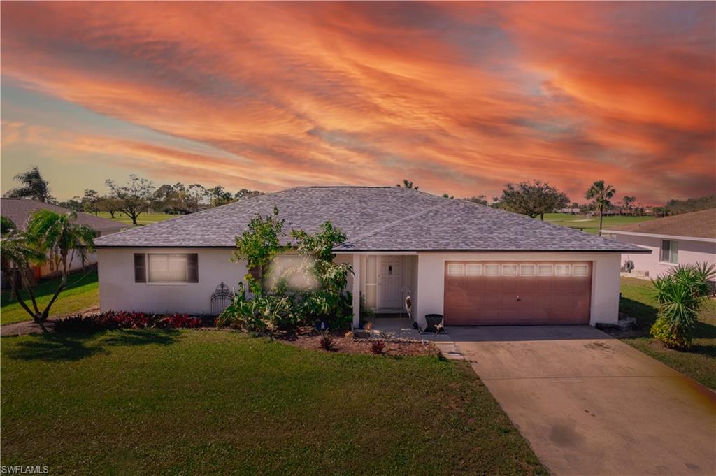 17600 Laurel Valley Road Fort Myers, FL 33967 - Photo 26 of 26 front view of a house with a garden