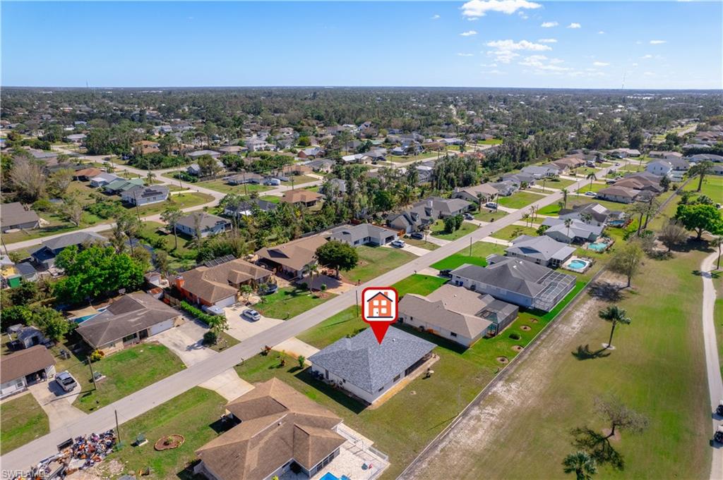 17600 Laurel Valley Road Fort Myers, FL 33967 - Photo 3 of 26 an aerial view of a city with lots of residential buildings ocean and mountain view in back