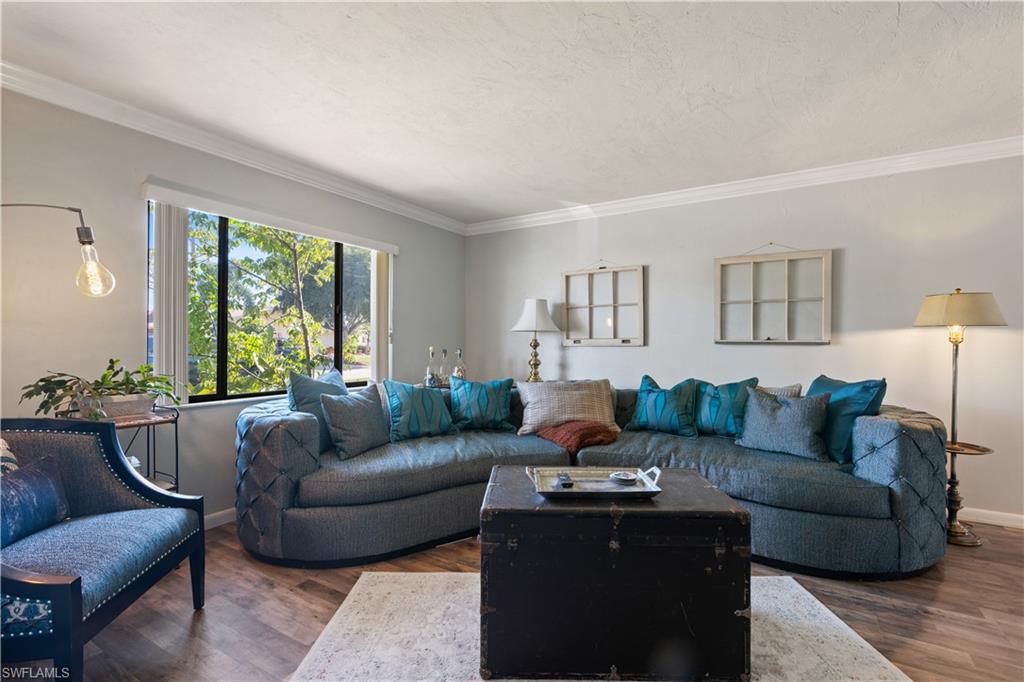 17600 Laurel Valley Road Fort Myers, FL 33967 - Photo 6 of 26 a living room with furniture and a large window