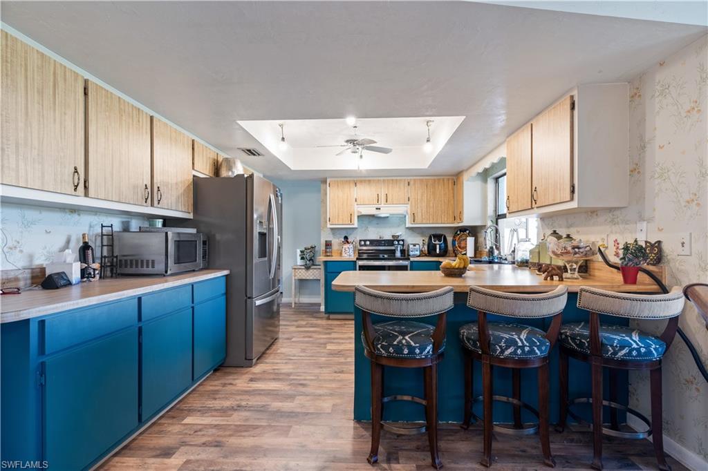 17600 Laurel Valley Road Fort Myers, FL 33967 - Photo 9 of 26 a kitchen with granite countertop a sink and a stove