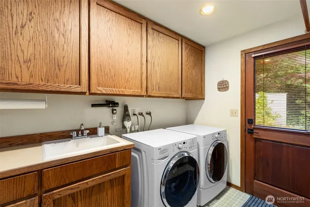 a utility room with dryer and washer