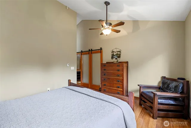 a bedroom with a bed and dresser