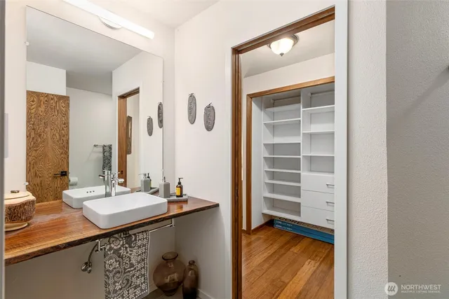 a bathroom with a sink a vanity and a mirror